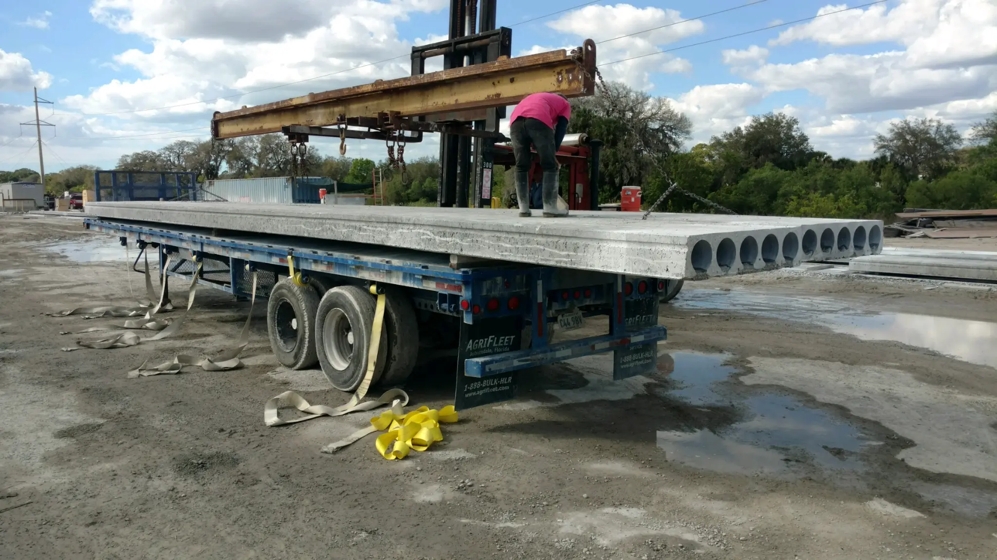 Hollowcore planks loaded on flatbed trailer showing circular hollow cores